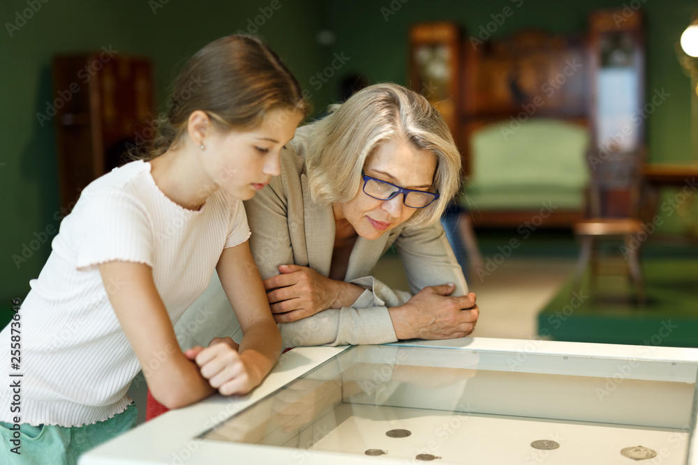 Woman and girl visiting museum