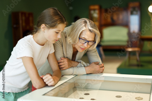 Woman and girl visiting museum