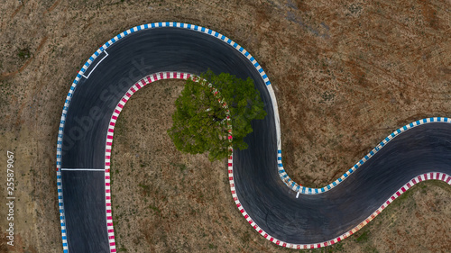 Curving race track view from above, Aerial view car race asphalt track and curve. © Kalyakan