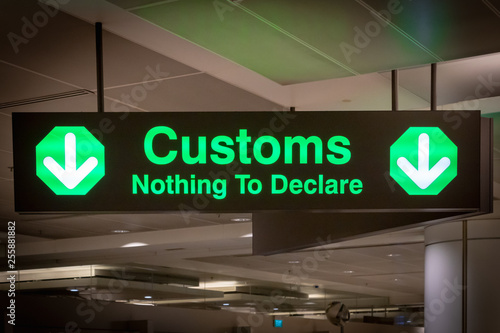 airport customs signboard icon in international airport at immigration control  photo
