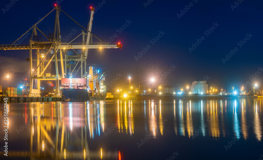 Containers loading by crane at night, , Trade Port , Shipping.
