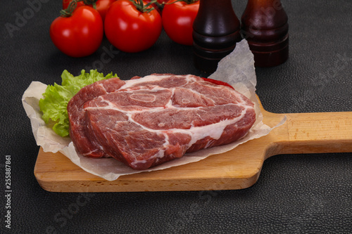 Raw pork neck steak