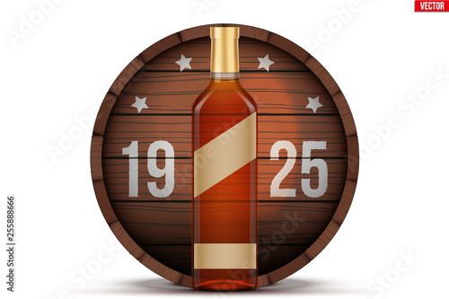 Whiskey bottle and wooden barrel