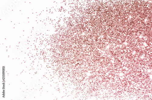 Rose gold glitter on white background