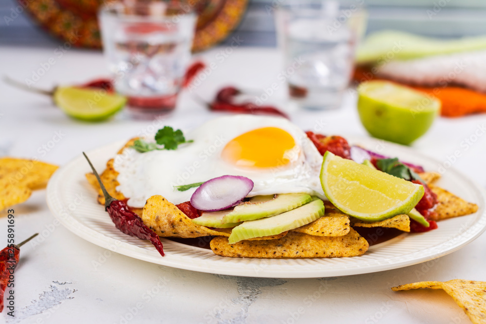 Mexican breakfast - chilaquiles dish Mexican breakfast - chilaquiles dish