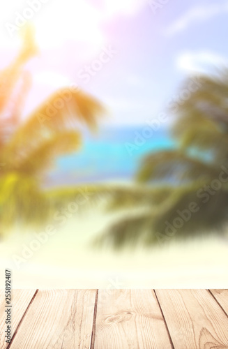 Wooden table top on blurred seascape background