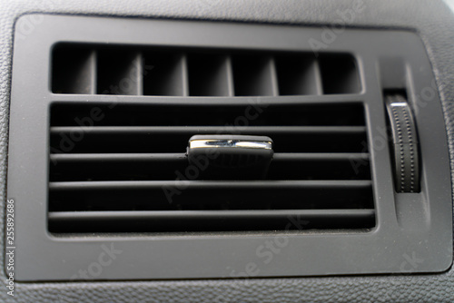 the deflector on the grey panel of the car. car heating and air conditioning system © vladimir