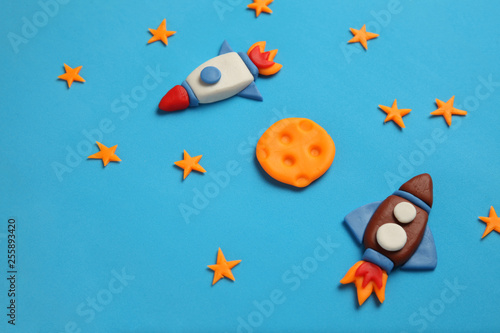 Two kid (child) rocket in space, adventure and science. Stars, and moon. Plasticine art, cartoon. © Andrii Zastrozhnov