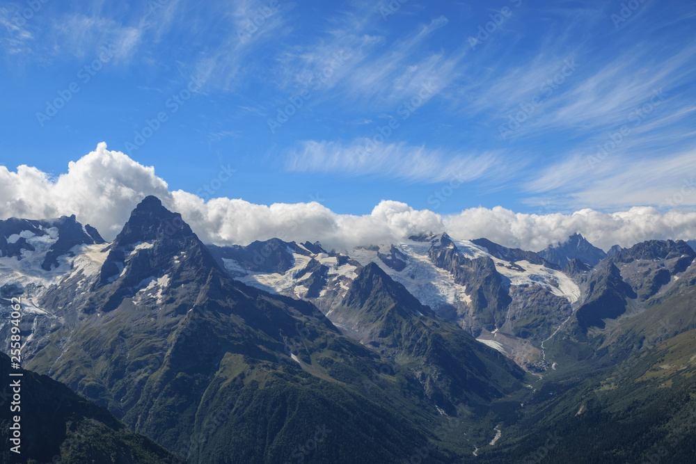 Panorama view of dramatic sky and mountains scene in national park Dombay Panorama view of dramatic sky and mountains scene in national park Dombay