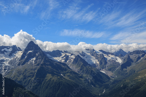 Panorama view of dramatic sky and mountains scene in national park Dombay © TravelFlow