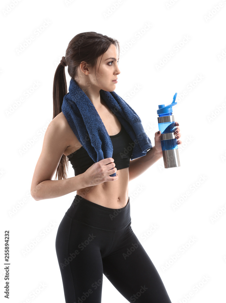 Sporty young woman with bottle of water against white background Sporty young woman with bottle of water against white background