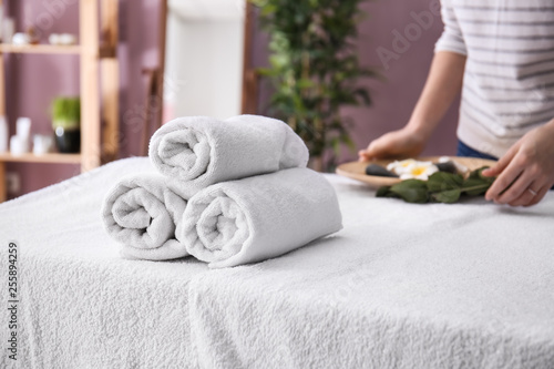 Fototapeta Naklejka Na Ścianę i Meble -  Rolled towels on table in spa salon