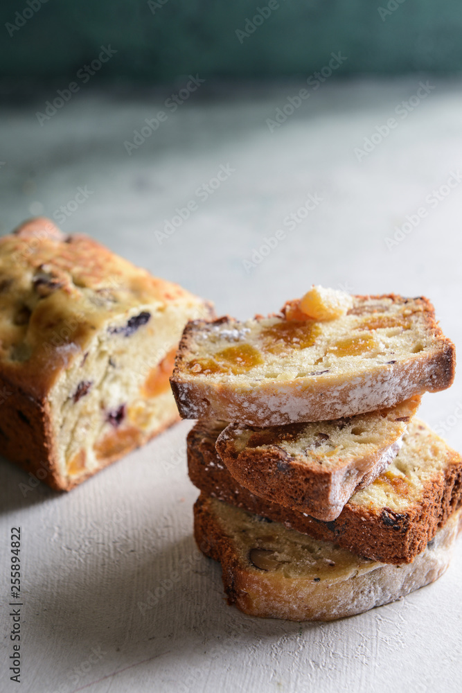 Pieces of tasty cake on light background