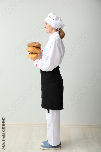 Beautiful female baker near...
