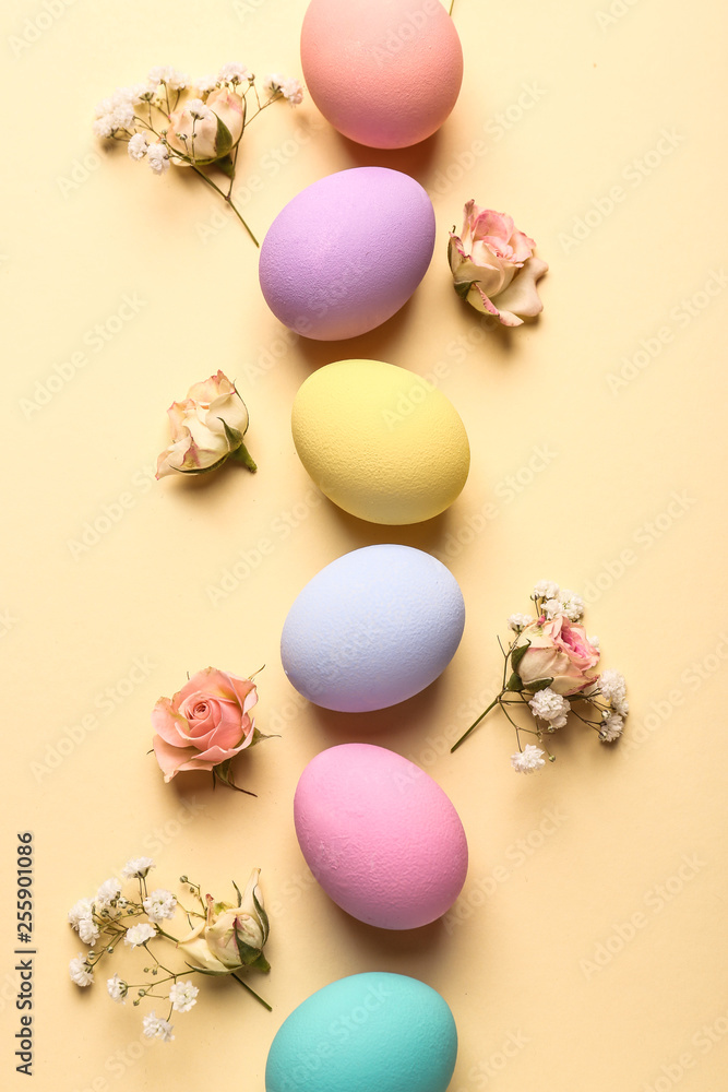 Easter eggs with flowers on color background Easter eggs with flowers on color background