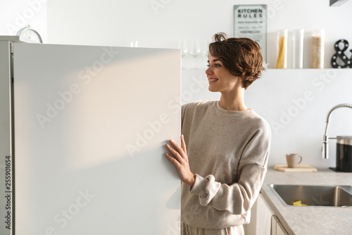 Happy young woman standing photo