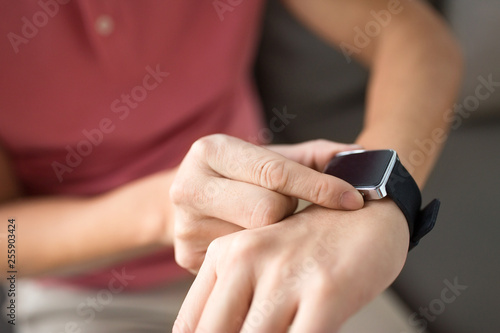 technology  time and people concept - close up of male hands with smart watch