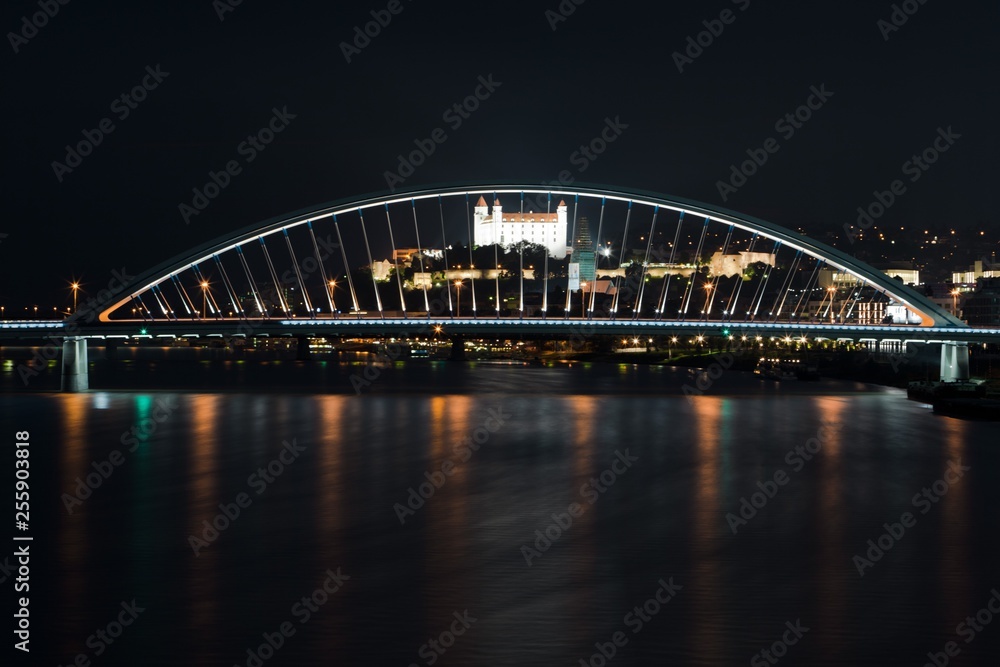 Naklejka premium Night Bratislava's dominants, castle and bridge.