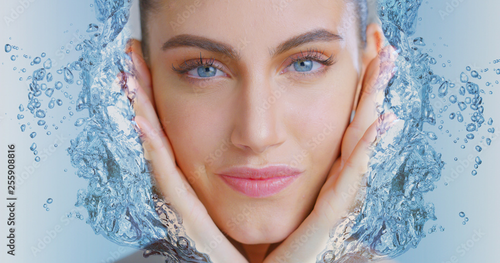 Portrait of woman with beautiful face and perfect skin just cleaned from impurities touching it gently with 3d water hands to show how soft, smooth and pure it is. Portrait of woman with beautiful face and perfect skin just cleaned from impurities touching it gently with 3d water hands to show how soft, smooth and pure it is.