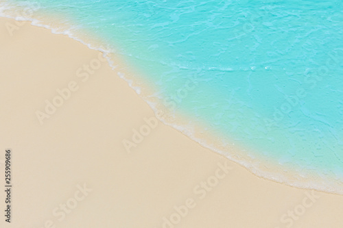 Fototapeta Naklejka Na Ścianę i Meble -  Soft waves of blue sea on the Maldives beach for the background.