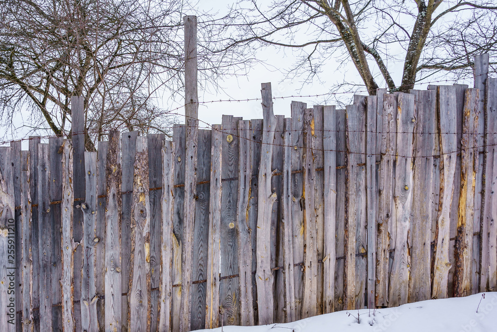 Fototapeta premium fence around the garden of nailing boards