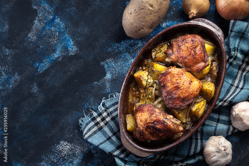 Roasted chicken thighs and potatoes - obrazy, fototapety, plakaty 