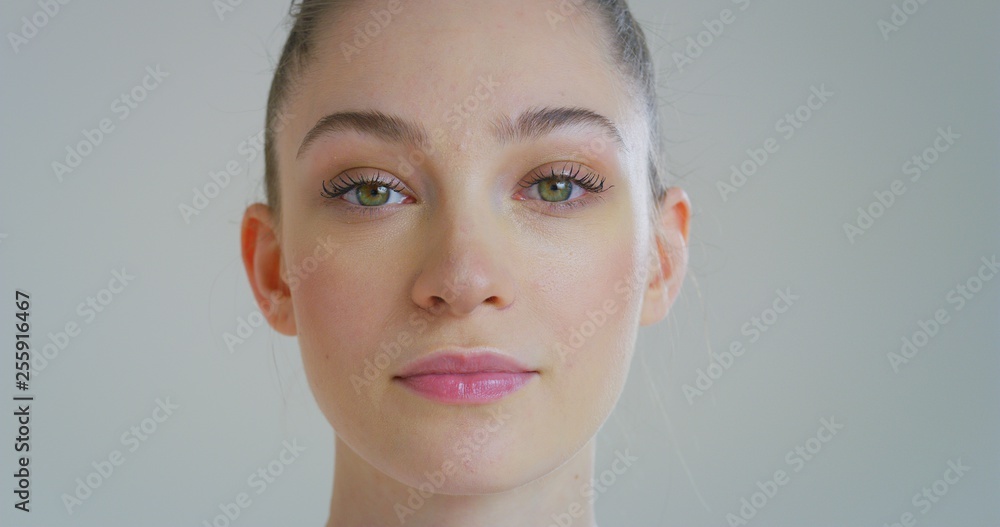 Portrait close up of young woman with beautiful face and perfect skin just cleaned from impurities ready for day or night cream is looking in camera. Portrait close up of young woman with beautiful face and perfect skin just cleaned from impurities ready for day or night cream is looking in camera.