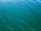 Ocean surface landscape from bird's eye drone view. Natural sea turquoise background. Copy space. Top view.