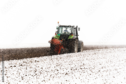Tractor plowing a field