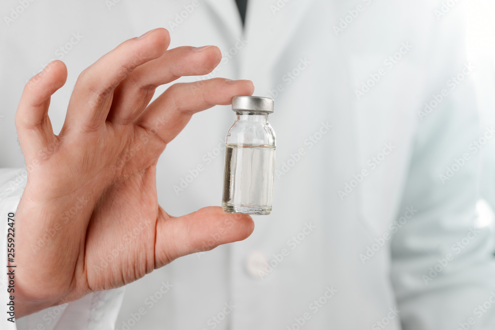 Scientist holding a vial Stock Photo Adobe Stock