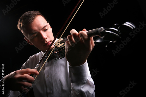 Young men playing the violin