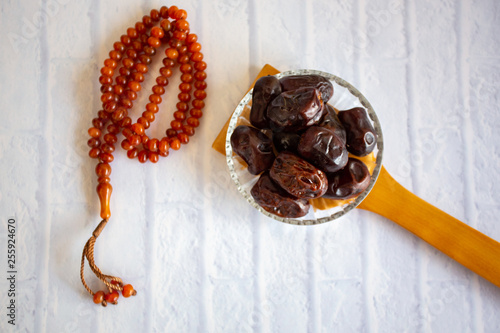 fthar Food evening meal for Ramadan kareem,Concept: Date of Islamic fasting,fruit date placed on a white background rosary photo