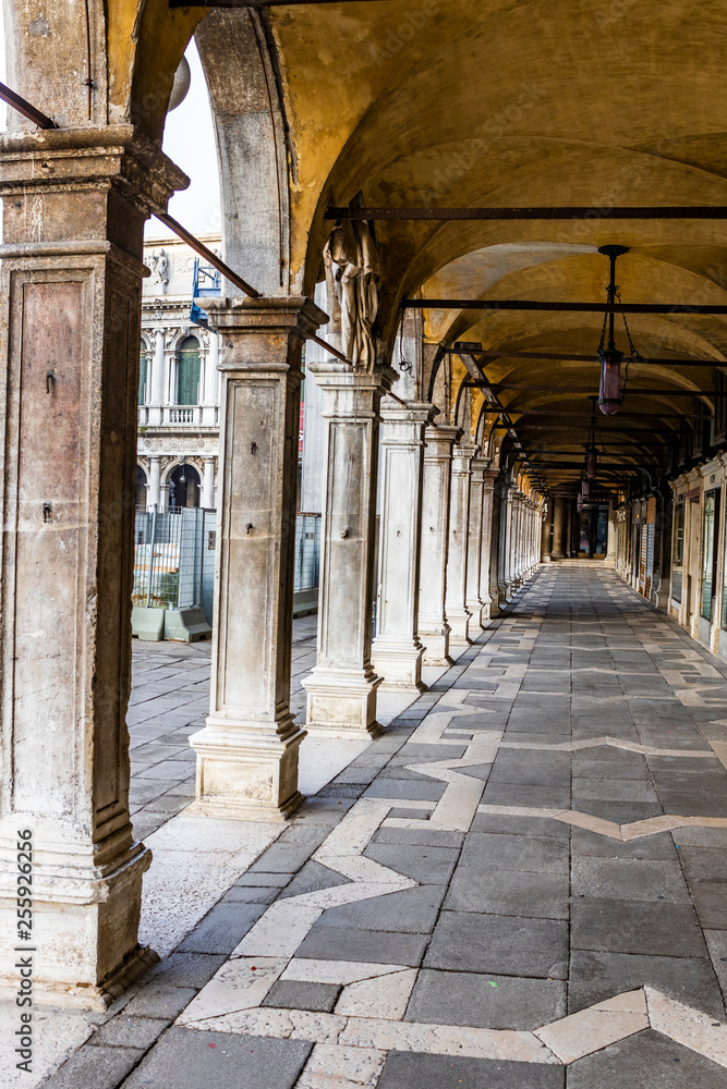 Arches and columns of San Marco square in Venice, Italy