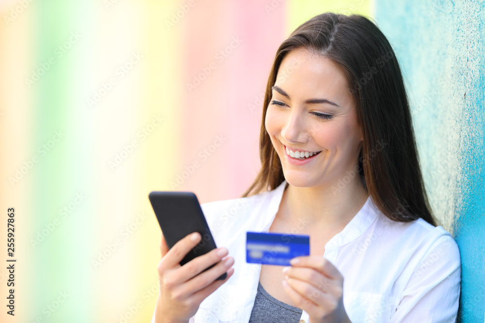 Happy buyer pays on line with credit card and phone