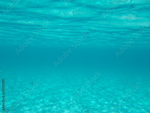 Crystal clear blue ocean water. Abstract background underwater concept
