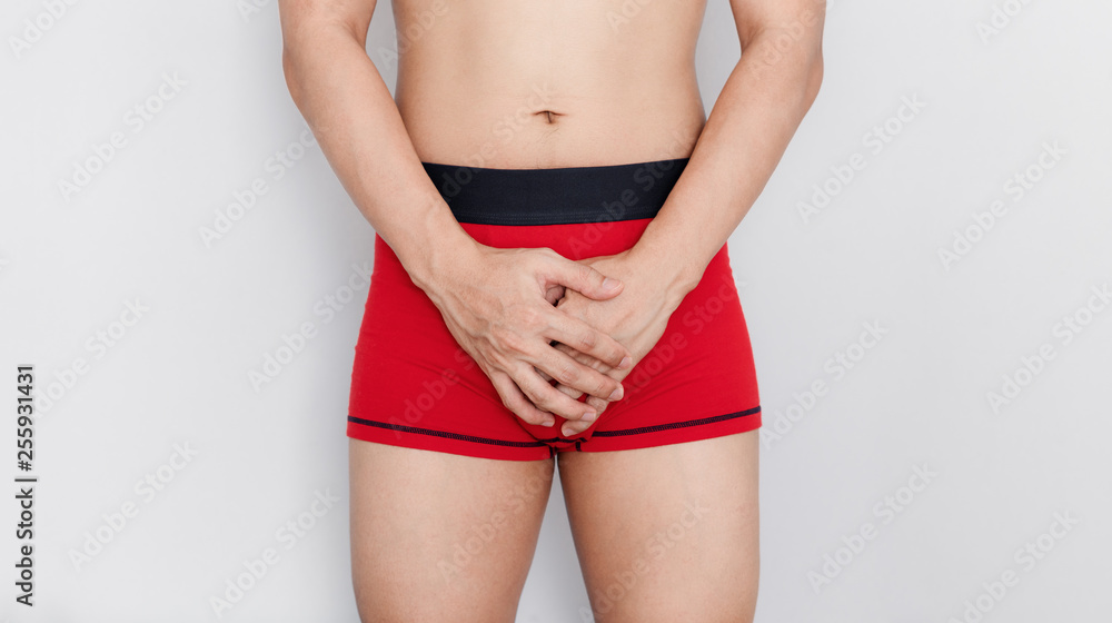 Close-up a man in red underwear. Men health, and sexual dysfunction problem Close-up a man in red underwear. Men health, and sexual dysfunction problem