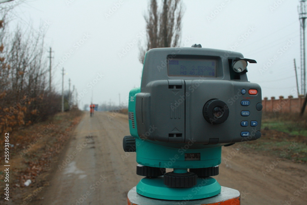 Digital level on the tripod. Leveling, geodetic works Digital level on the tripod. Leveling, geodetic works