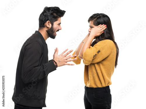 Foto Indian young couple quarreling isolated on white background