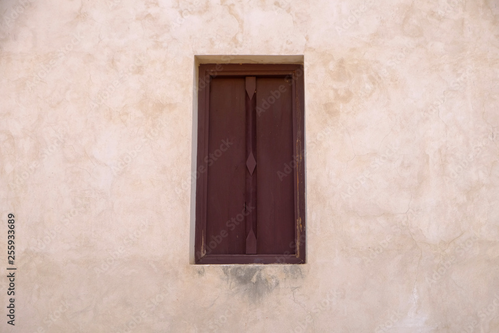 old wood window on grunge wall