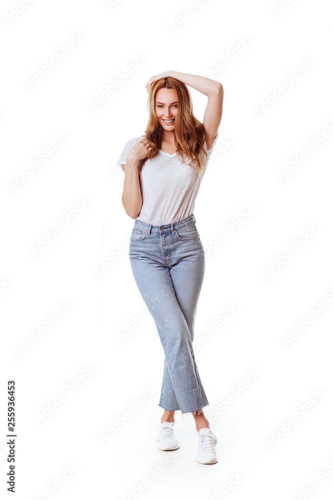 Portrait of a pretty smiling woman posing isolated on a white background Portrait of a pretty smiling woman posing isolated on a white background