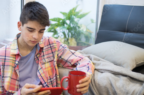 teenager or student at home with mobile phone