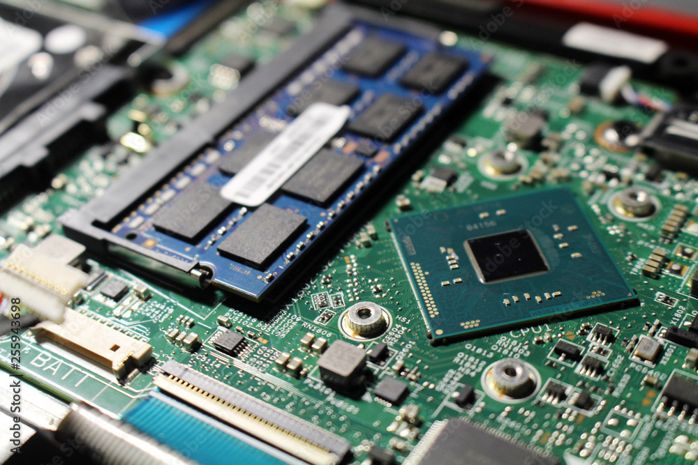 Closeup view at laptop motherboard and components. Closeup view at laptop motherboard and components.