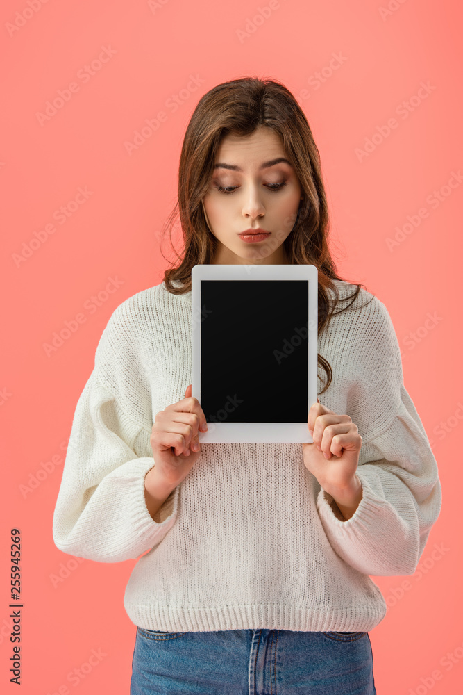 surprised young woman holding digital tablet with blank screen isolated on pink surprised young woman holding digital tablet with blank screen isolated on pink