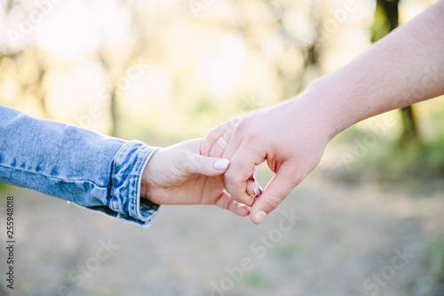 young couple holding hands