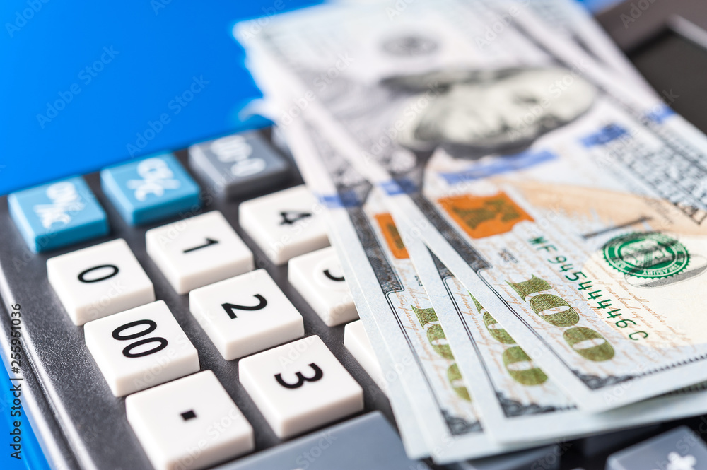 Business and financial background with dollars and calculator. Bookkeeping background. Business and financial background with dollars and calculator. Bookkeeping background.