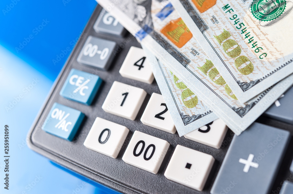 Business and financial background with dollars and calculator. Bookkeeping background. Business and financial background with dollars and calculator. Bookkeeping background.
