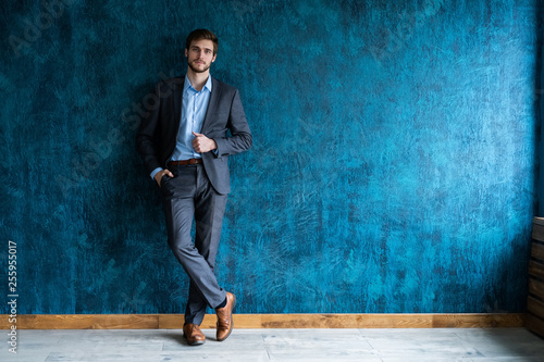 Smiling businessman full length portrait