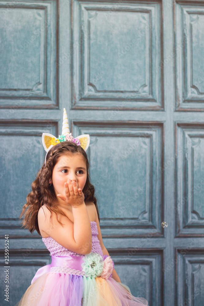Naklejka premium girl in a unicorn costume