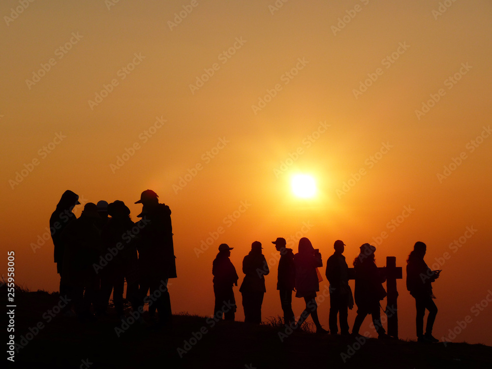 Silhouette of tourists on a scenic sunrise at Phu Lomlo mountain, Loei, Thailand