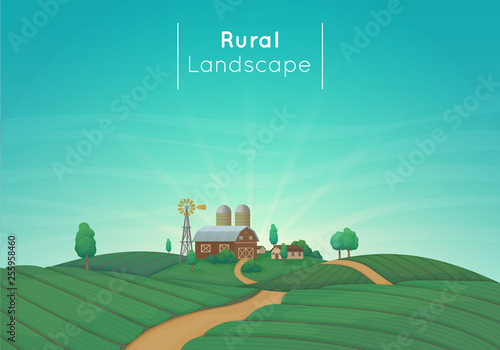 Rural farming landscape vector illustration. Farm house, barn, silos, windmill with bushes and trees. Green agricultural fields with a dirt road. Blue sky with clouds and sunbeams in the background.